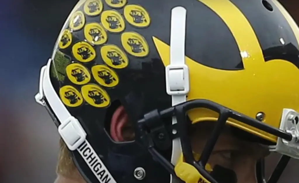 Is it a tradition to use stickers on football helmets?