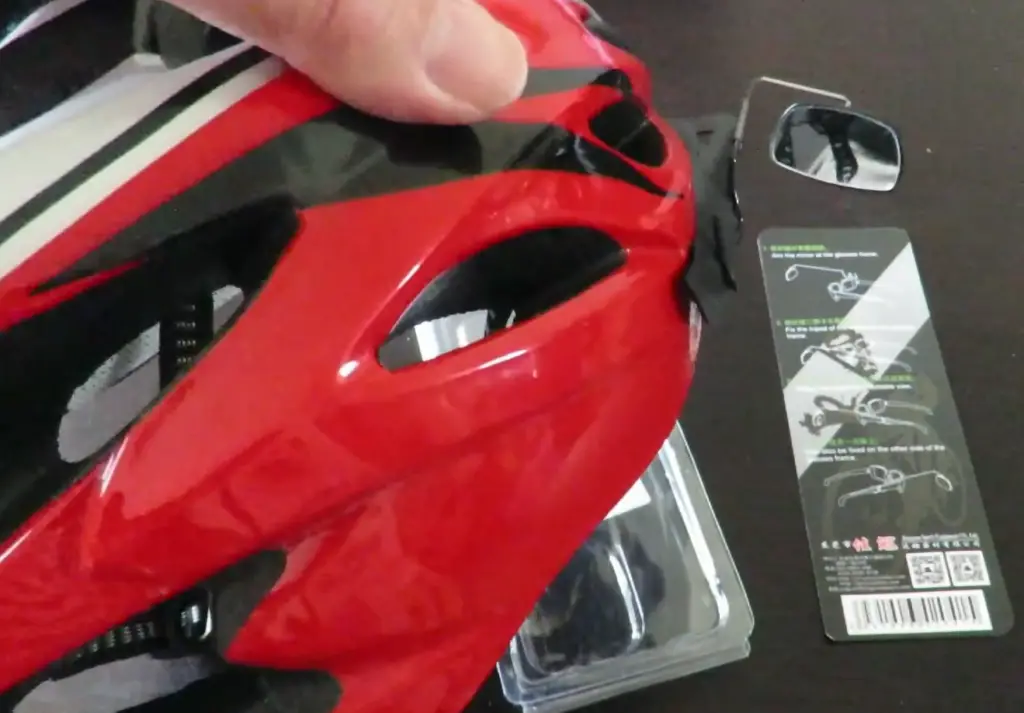 What are the benefits of using a bicycle helmet mirror?
