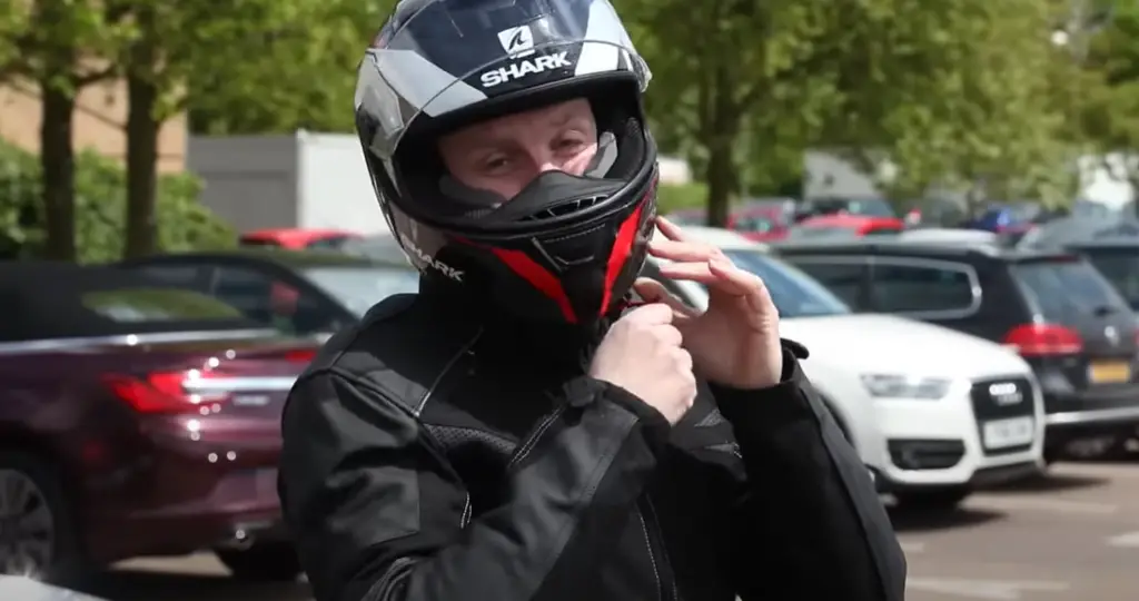 How do you hold a helmet properly?